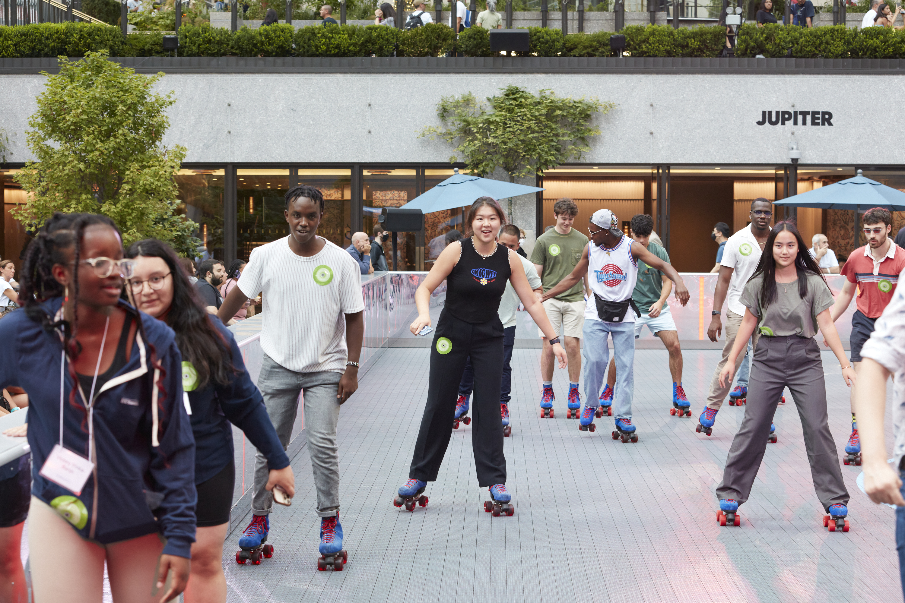 Fellows roller skate at Rockefeller Center.
